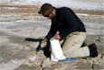Greg Balco collects a rock sample Jan. 10th while conducting fieldwork in the McMurdo Cry Valleys
