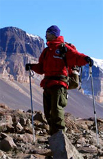Scientist Jaakko Putkonen uses trekking poles to make his way across the rocky terrain in the McMurdo Dry Valleys