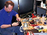 Researcher Dan Detrick repairs equipment in the new science lab in the elevated station.