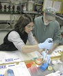 Mo Hodgins (left) and Jesse McGill process water samples in the lab onboard the Laurence M. Gould.