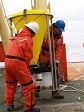 USAP marine science personnel prepare to deploy a sediment trap off the side of the NBP