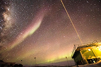This image captures both the LiDAR systems in action, as well as polar cap auroral arcs overhead and the glow of the auroral oval near horizon. Photo by Danny Hampton, Ian Geraghty, and Zimu Li
