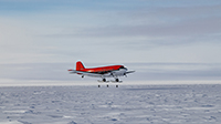 A Basler lands at South Pole Station.  Photo by Danny Hampton. Image courtesy of NSF/USAP Photo Library.
