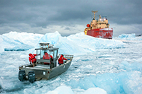 A boat from Palmer Station approaches the research vessel Laurence M. Gould. Photo by Cynthia Spence. Image courtesy of NSF/USAP Photo Library. 
