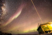 This image captures both the LiDAR systems in action, as well as polar cap auroral arcs overhead and the glow of the auroral oval near horizon. Photo by Danny Hampton, Ian Geraghty, and Zimu Li.