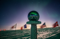 South Pole ceremonial marker. Photo by Jeff Capps, courtesy of the NSF/USAP Photo Library.